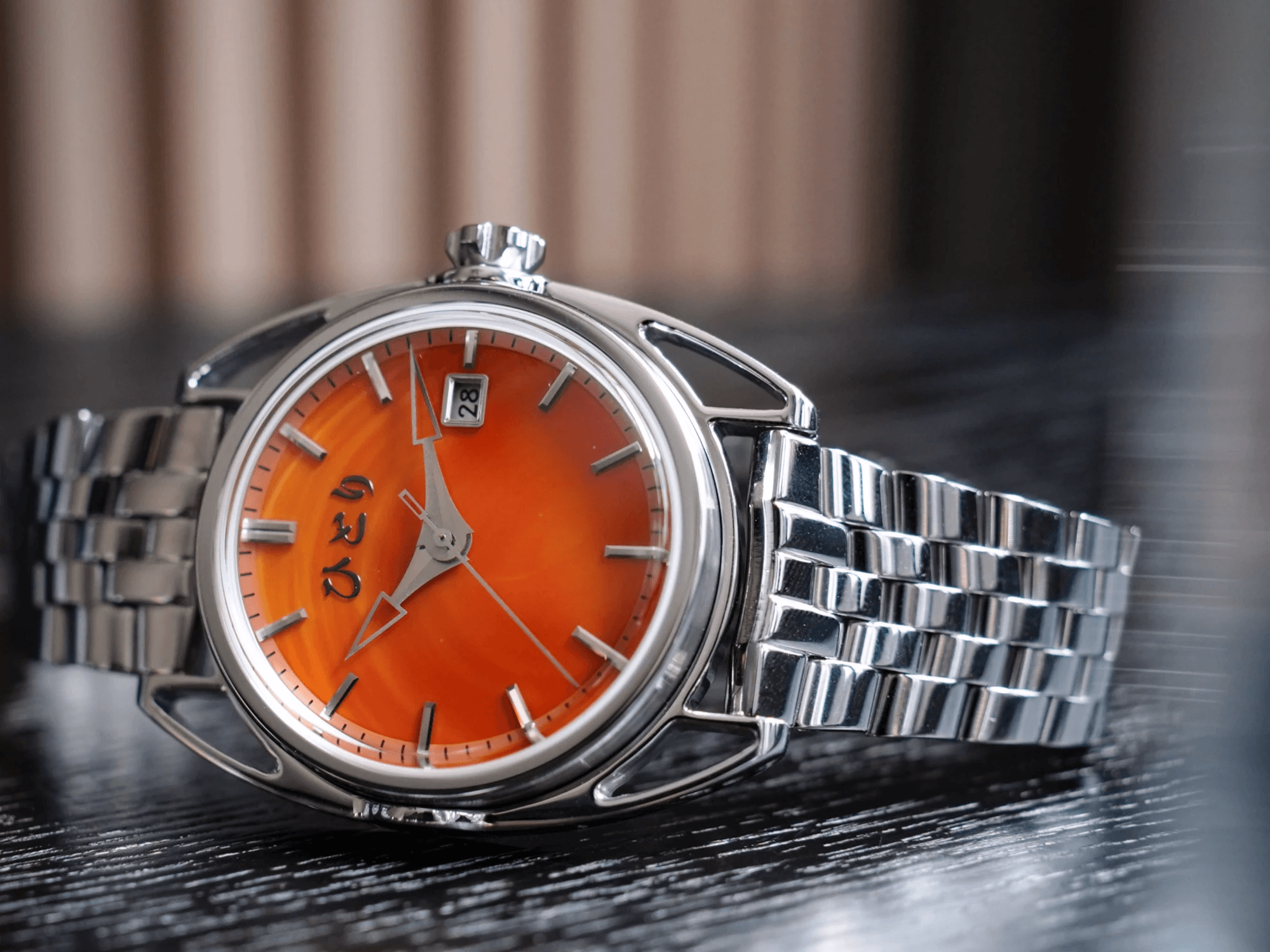 Hitori Nexus Tokiiro no Hitori, orange dial on a steel bracelet